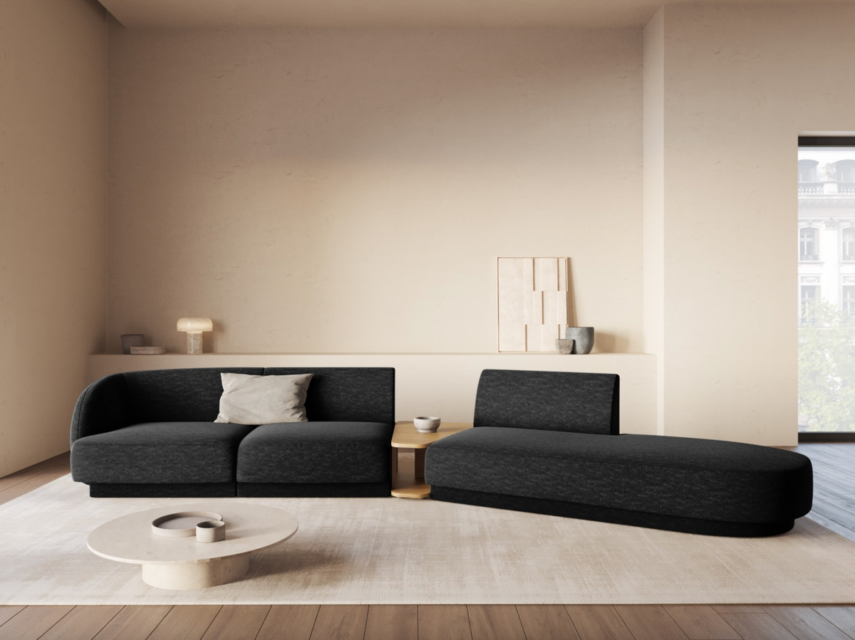 
Modulares Design Sofa „Miley“ mit Beistelltisch (4-Sitzer) - Chenille Schwarz / Ottomane links