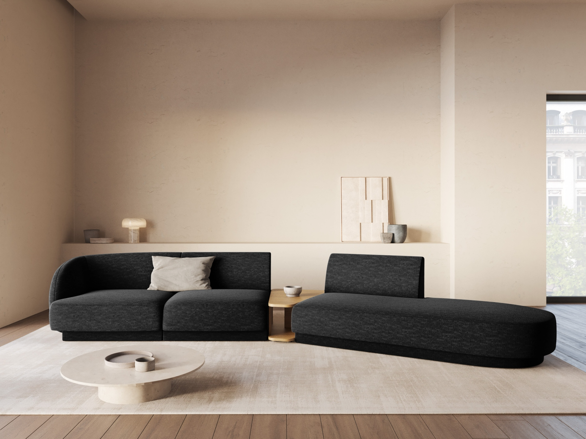 
Modulares Design Sofa „Miley“ mit Beistelltisch (4-Sitzer) - Chenille Schwarz / Ottomane rechts